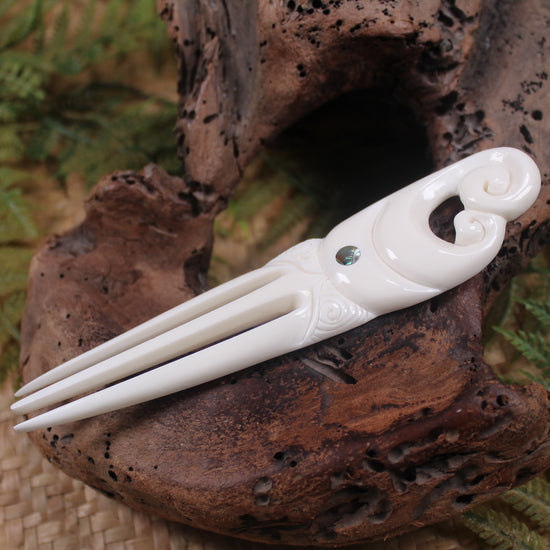 Heru with Koru carved from beef bone