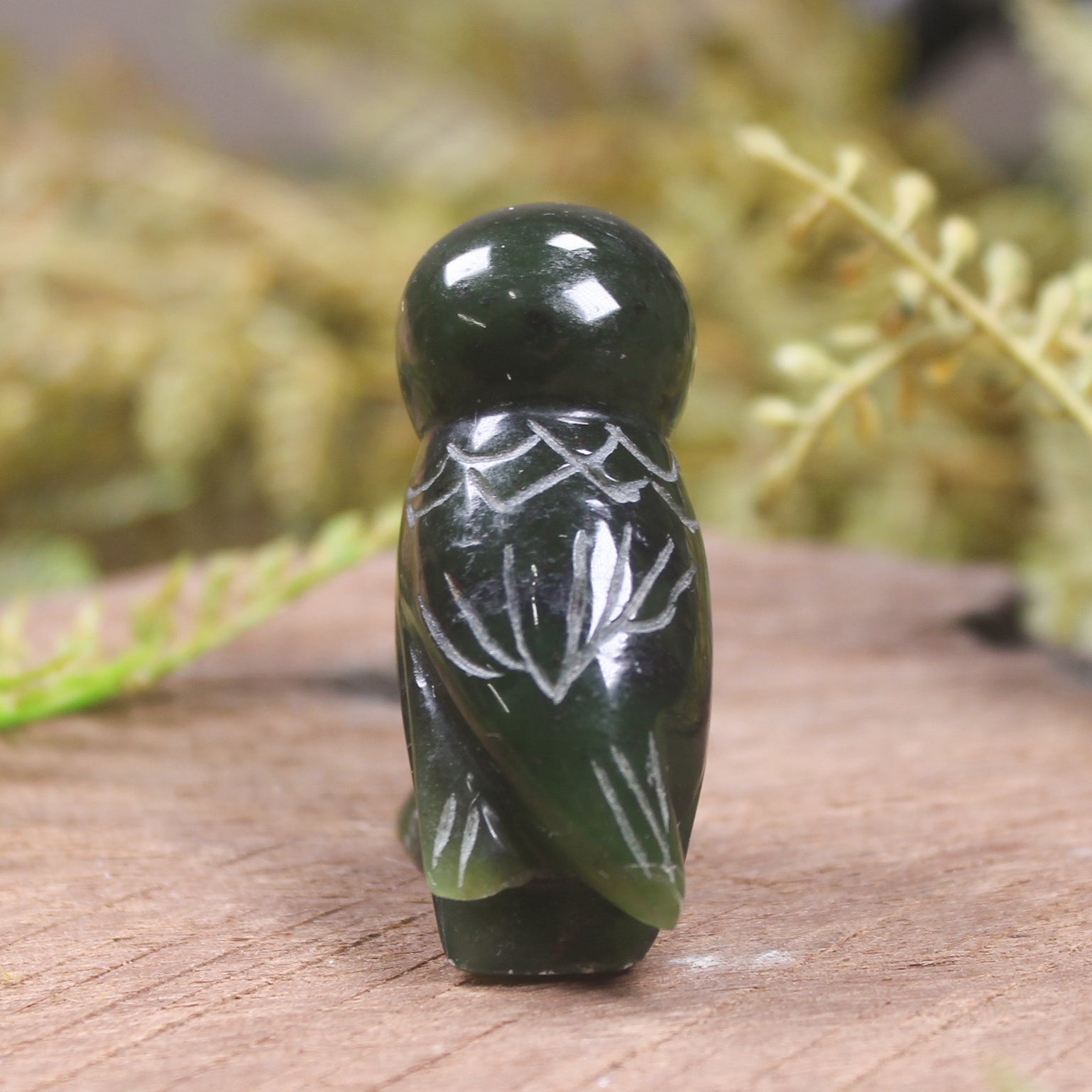 Pounamu owl sculpture