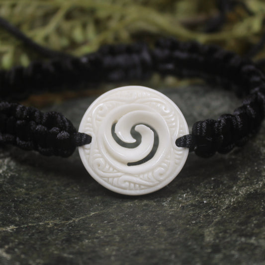 Adjustable cord bracelet with bone pendant