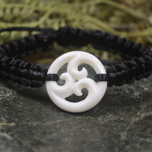 Adjustable cord bracelet with bone pendant