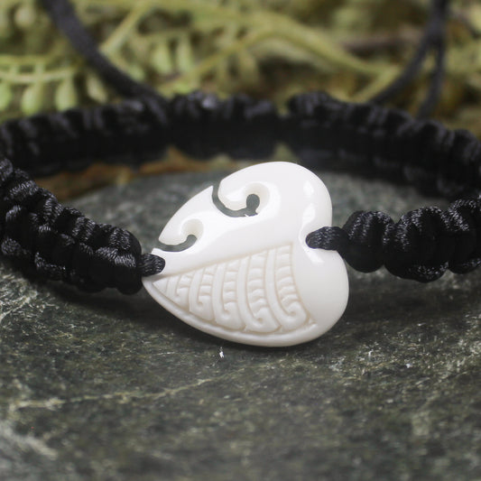Adjustable cord bracelet with bone pendant