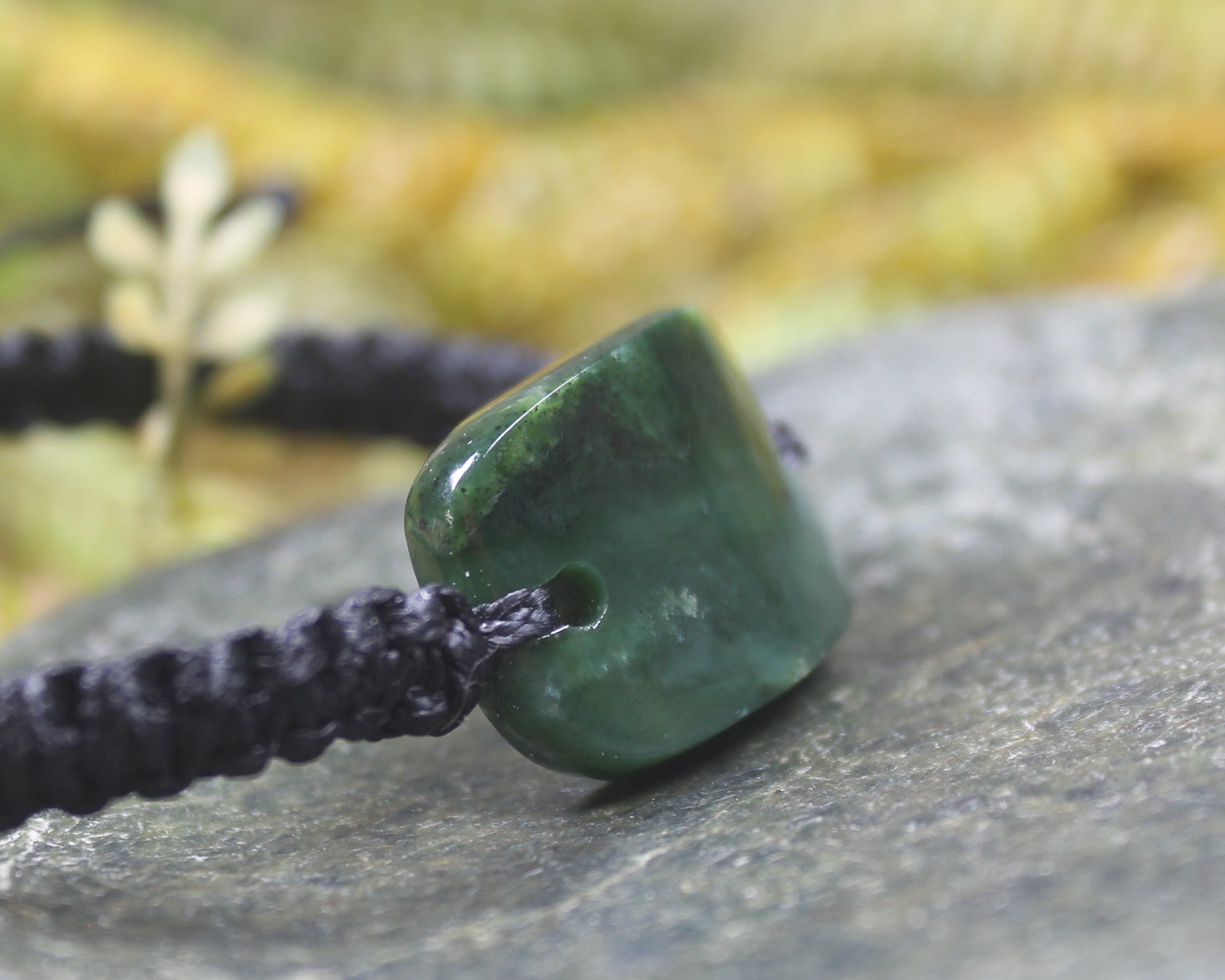 Adjustable cord bracelet with Kawakawa Pounamu