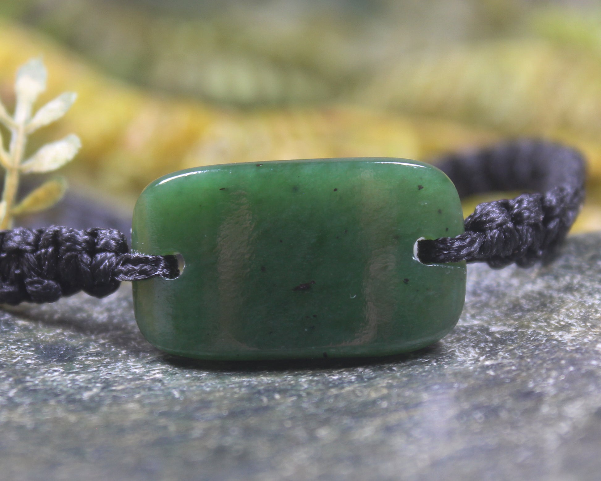 Adjustable cord bracelet with Kawakawa Pounamu