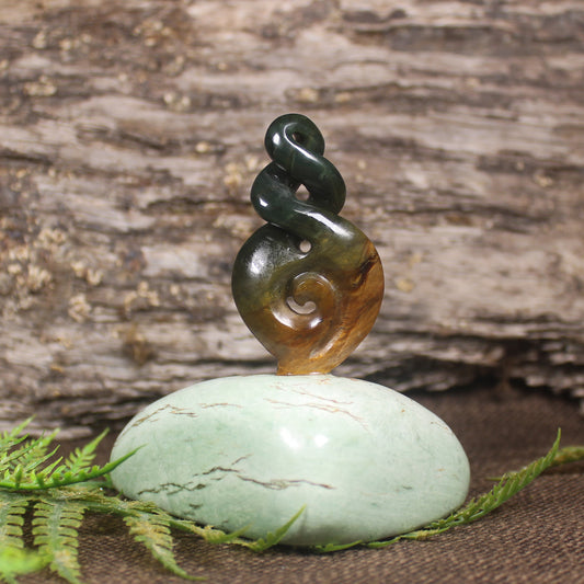 Flower Jade Pounamu Koru Twist set on a Pounamu base - NZ Greenstone