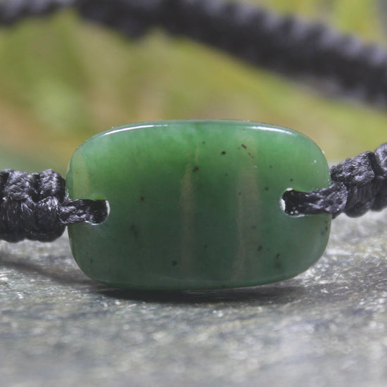 Adjustable cord bracelet with Hapopo Pounamu