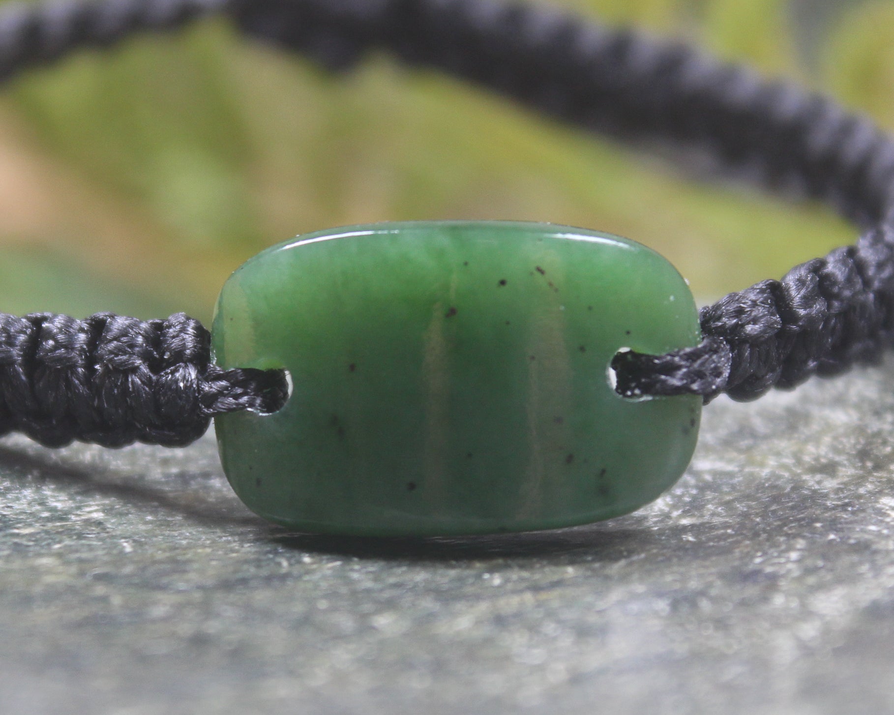 Adjustable cord bracelet with Hapopo Pounamu