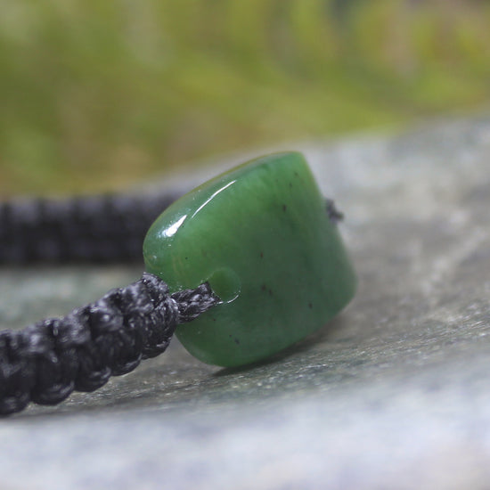 Adjustable cord bracelet with Hapopo Pounamu