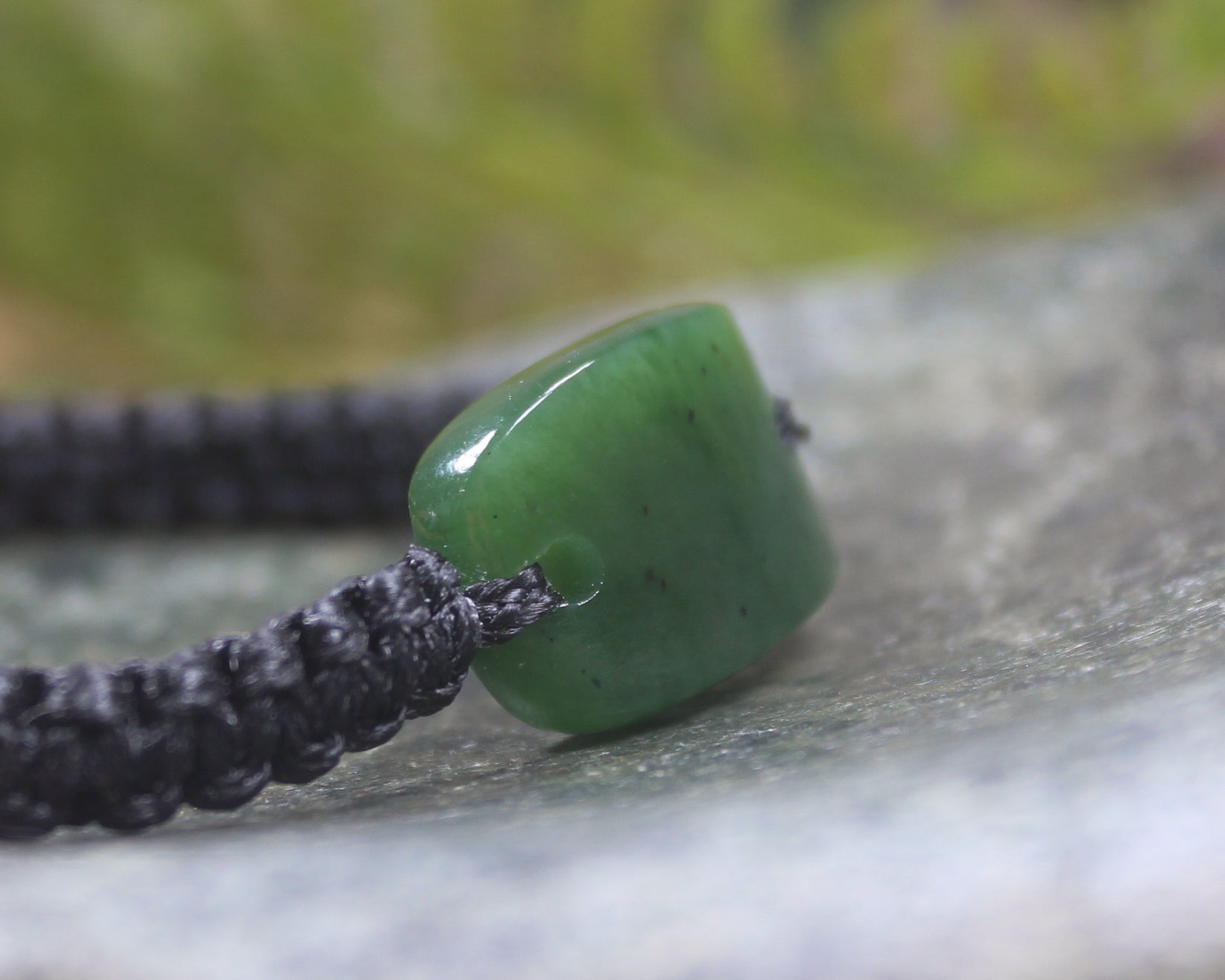 Adjustable cord bracelet with Hapopo Pounamu