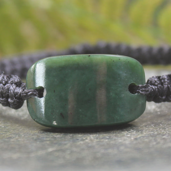 Adjustable cord bracelet with Kawakawa Pounamu