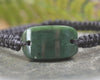 Adjustable cord bracelet with Kawakawa Pounamu
