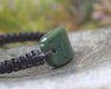 Adjustable cord bracelet with Kawakawa Pounamu