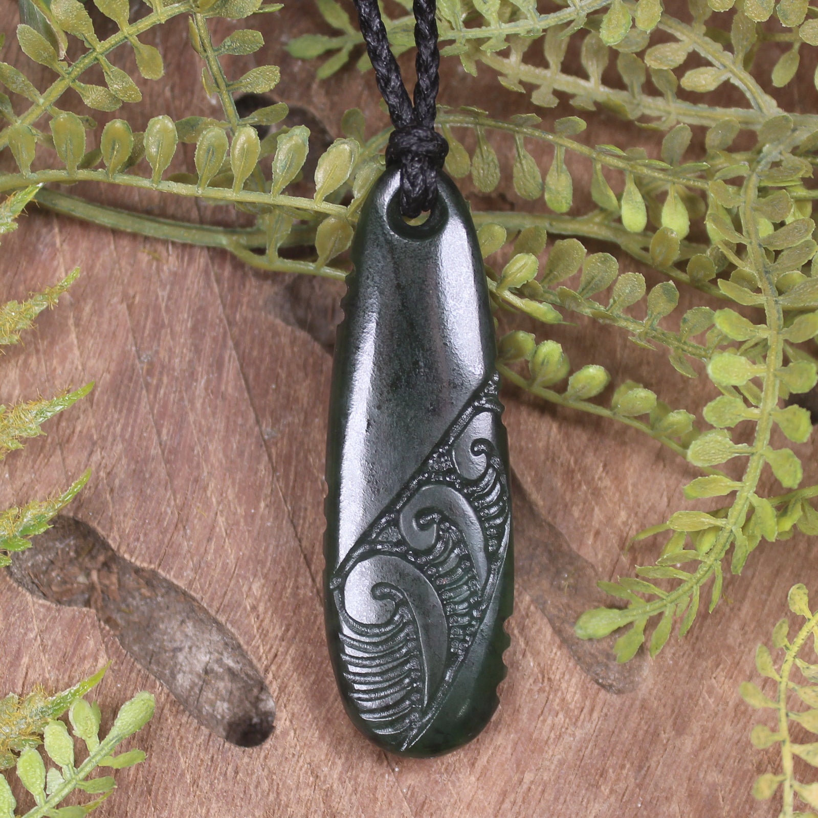 Roimata or Teardop with Koru carved from Rimu Pounamu - NZ Greenstone