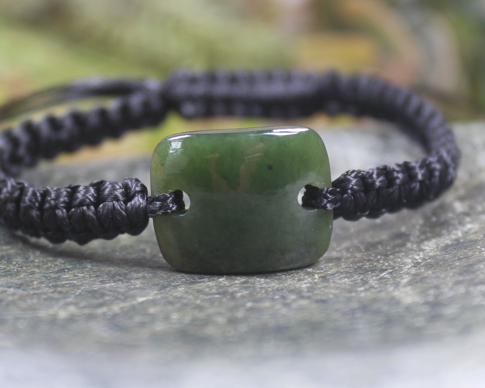 Adjustable cord bracelet with Kawakawa Pounamu