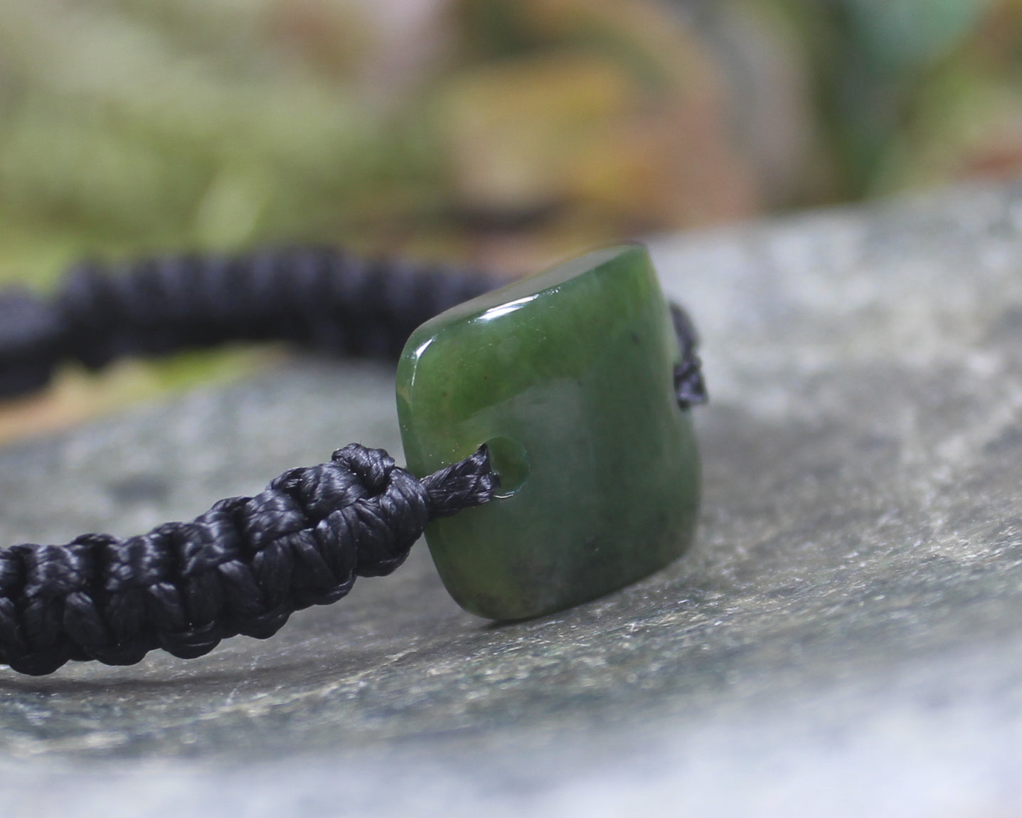 Adjustable cord bracelet with Kawakawa Pounamu