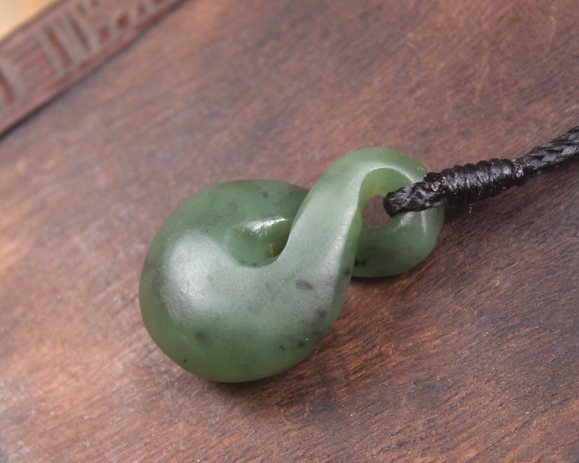 Twist or Pikorua carved from Hapopo Pounamu - NZ Greenstone