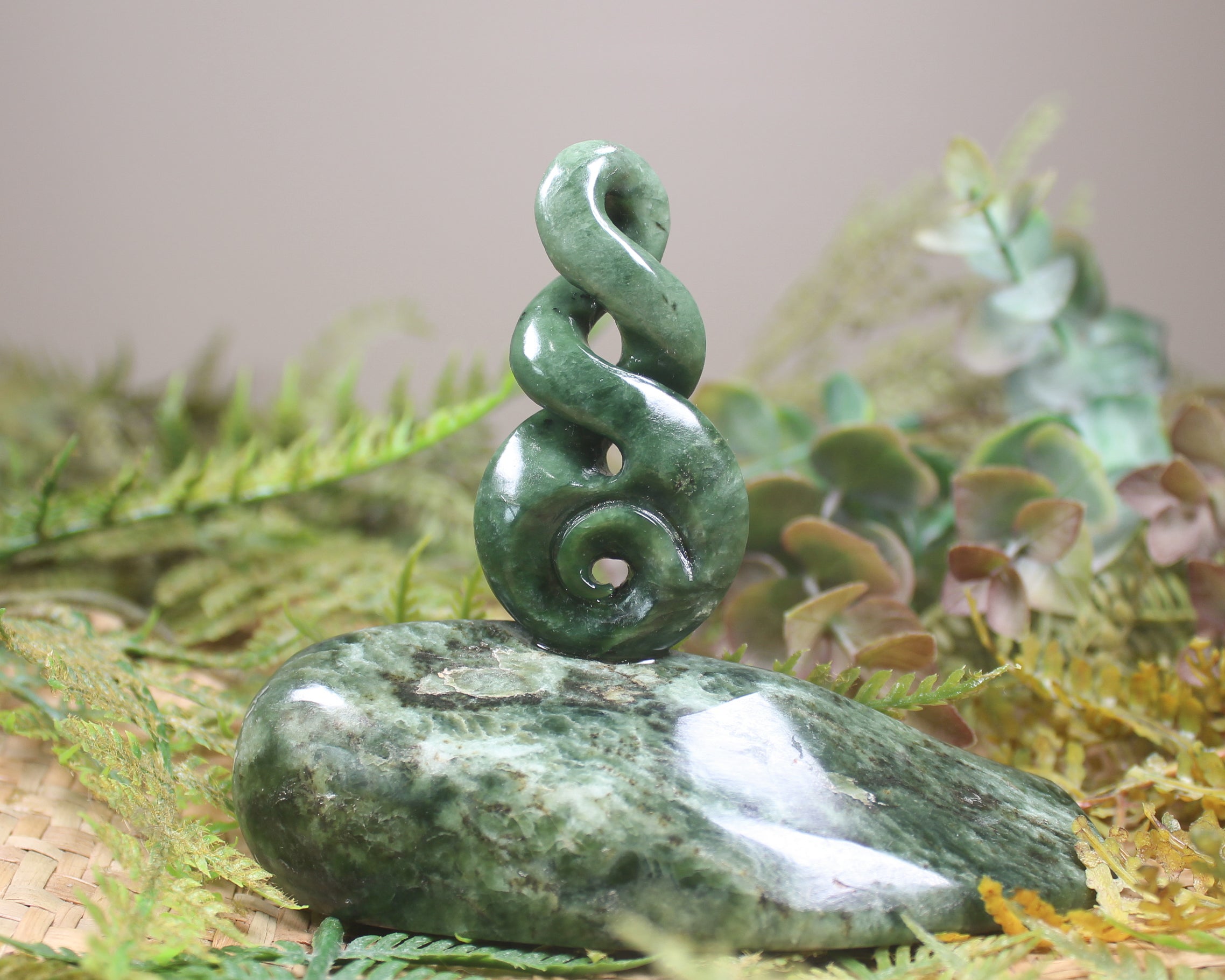 Kawakawa Pounamu Koru Twist set on a Pounamu base - NZ Greenstone