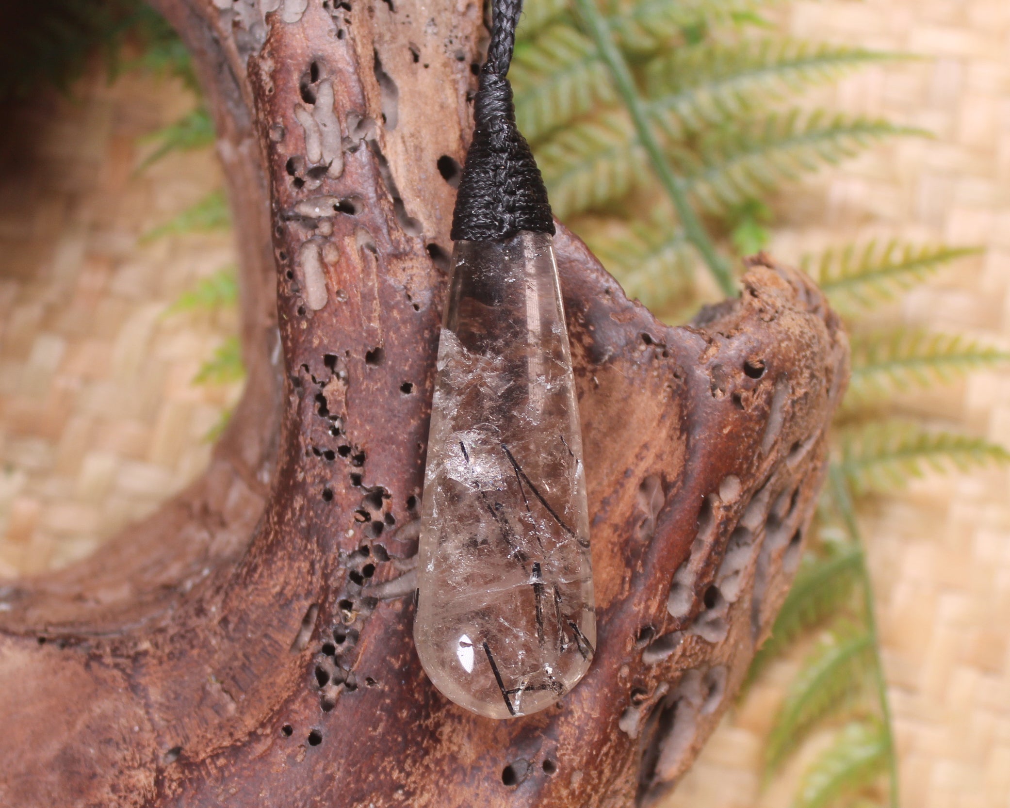 Clear Quartz with Black Tourmaline carved into a Roimata or Teardrop