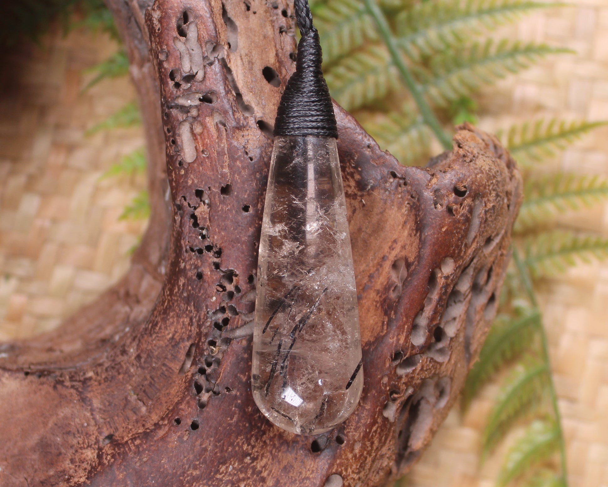 Clear Quartz with Black Tourmaline carved into a Roimata or Teardrop