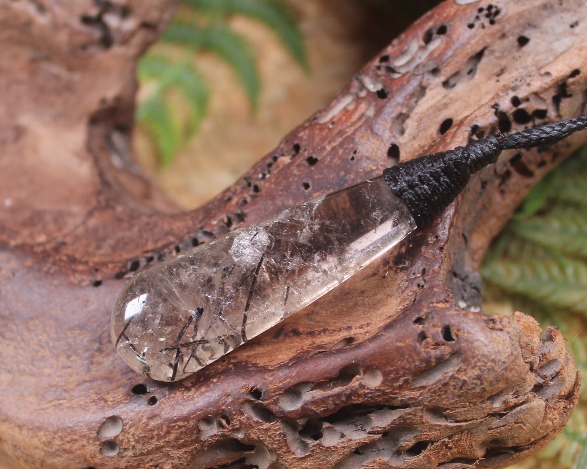 Clear Quartz with Black Tourmaline carved into a Roimata or Teardrop