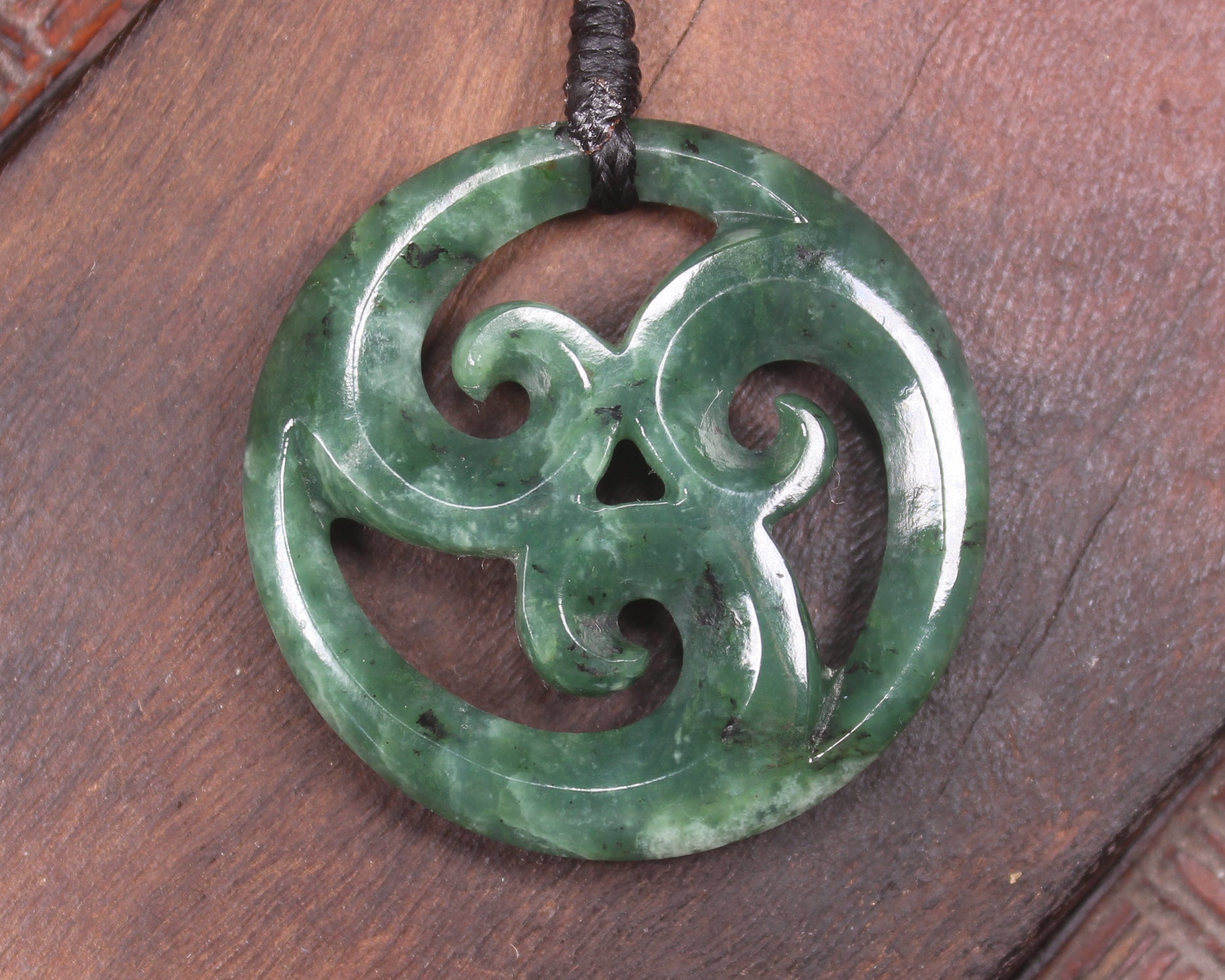 Koru pendant carved from Kawakawa Pounamu - NZ Greenstone