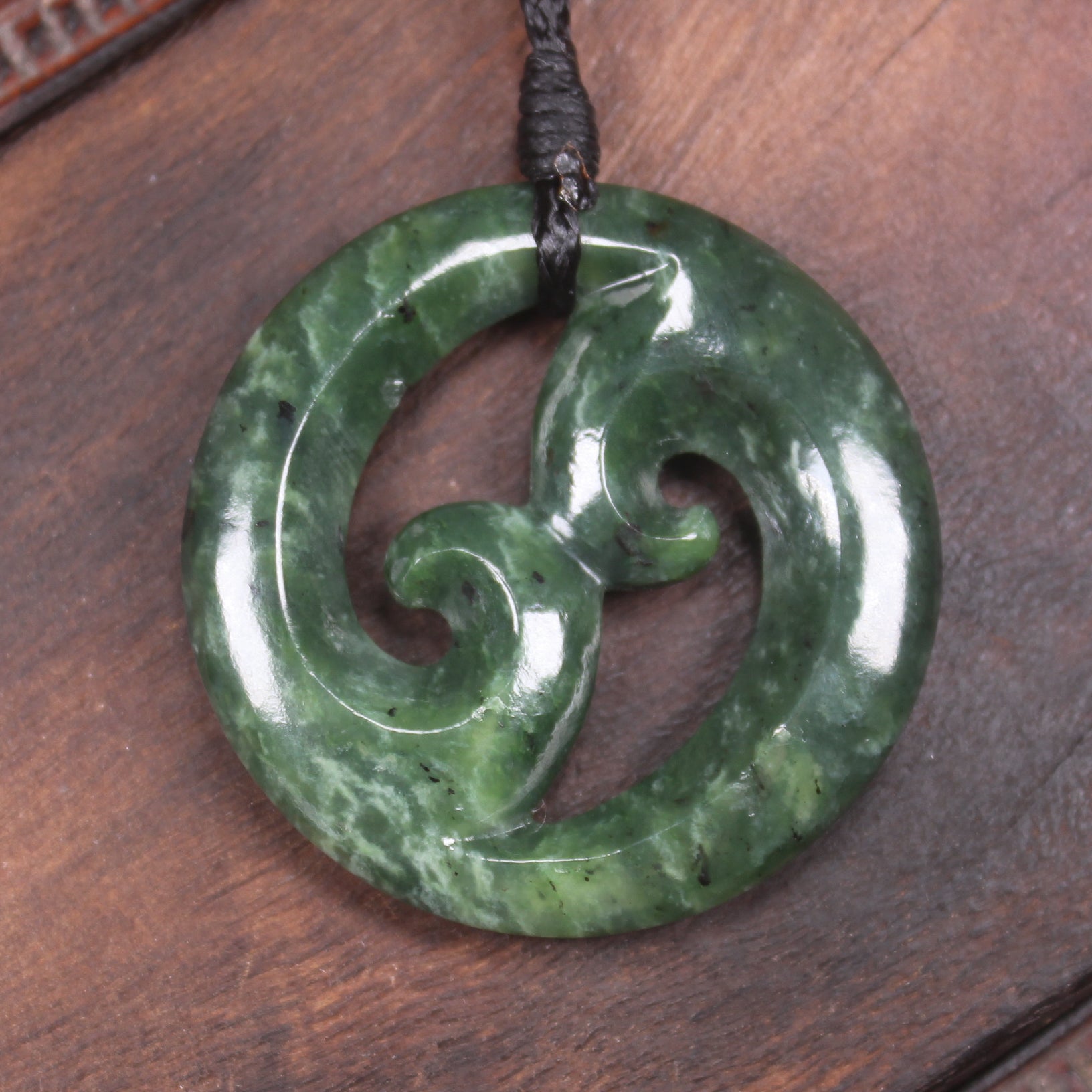 Koru pendant carved from Kawakawa Pounamu - NZ Greenstone
