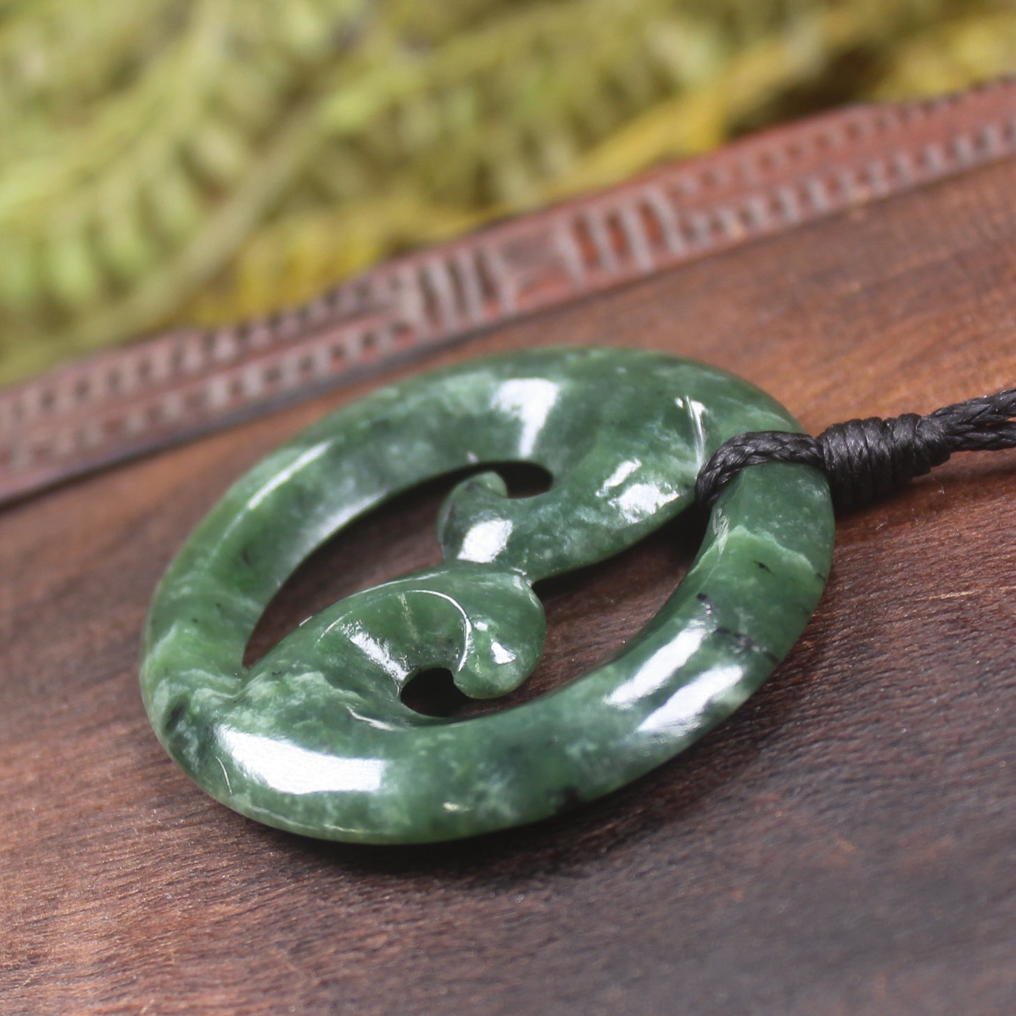 Koru pendant carved from Kawakawa Pounamu - NZ Greenstone