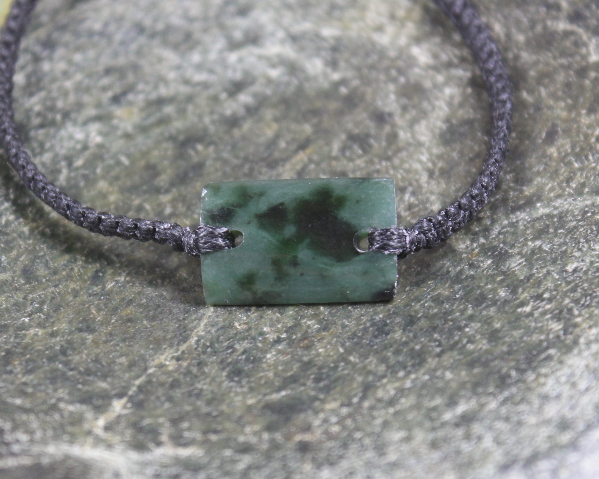 Adjustable cord bracelet with Rimu Pounamu