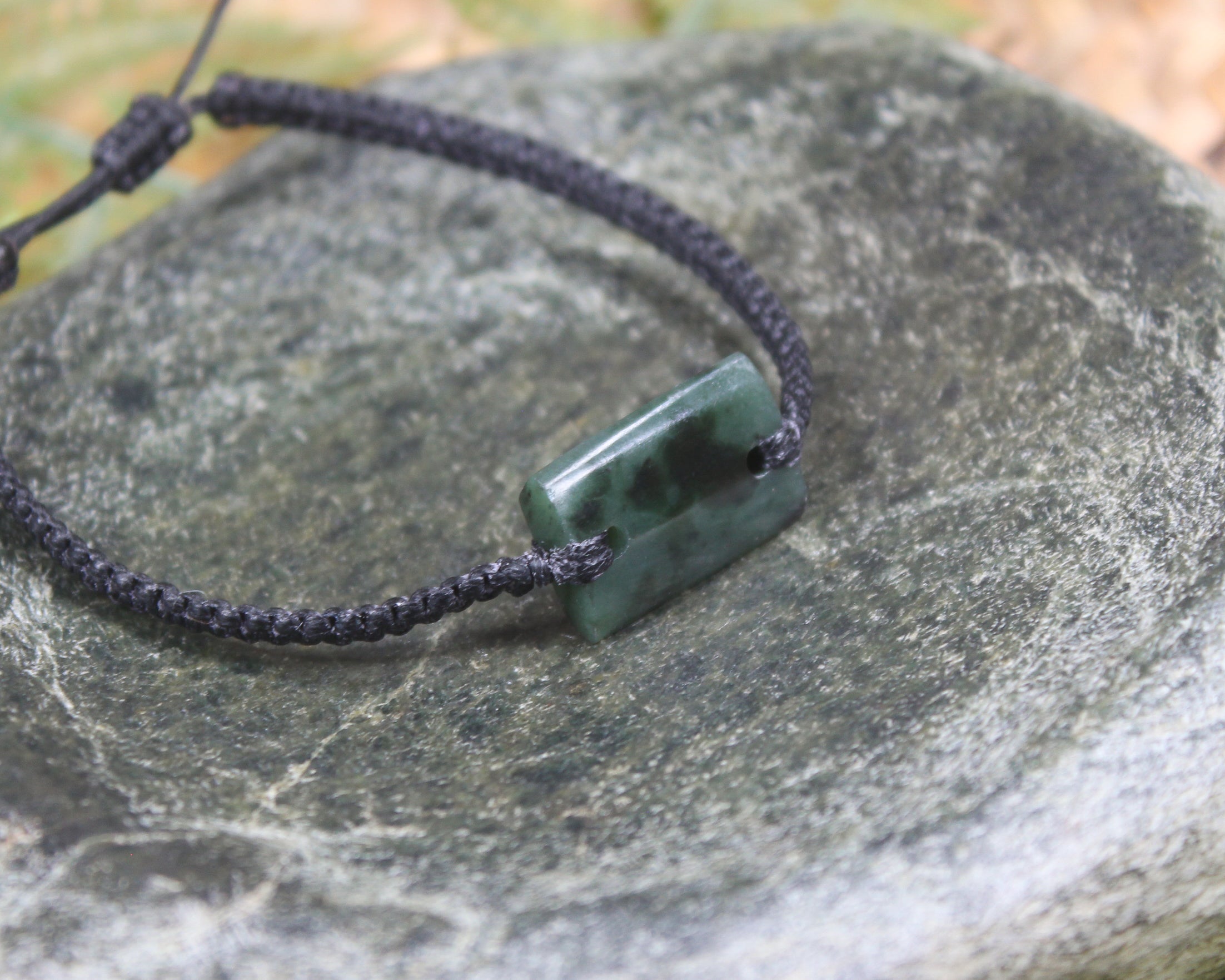 Adjustable cord bracelet with Rimu Pounamu