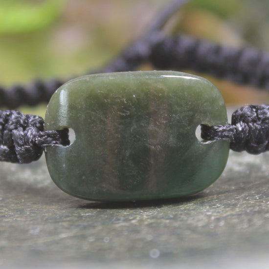Adjustable cord bracelet with Rimu Pounamu