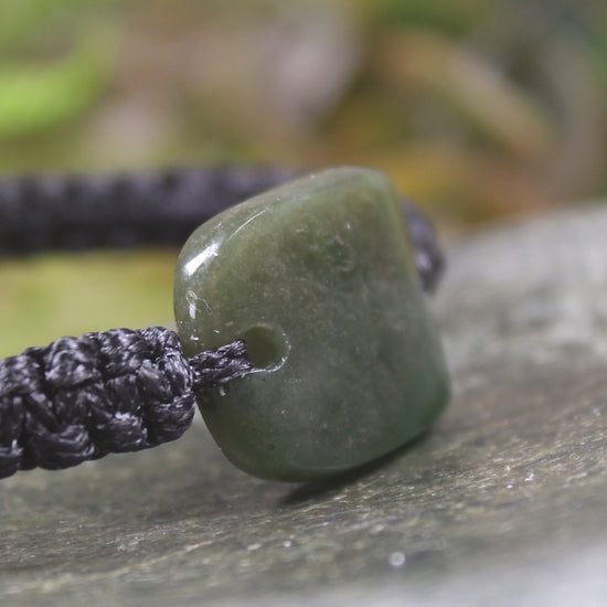 Adjustable cord bracelet with Rimu Pounamu