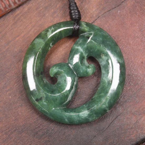 Koru pendant carved from Kawakawa Pounamu - NZ Greenstone