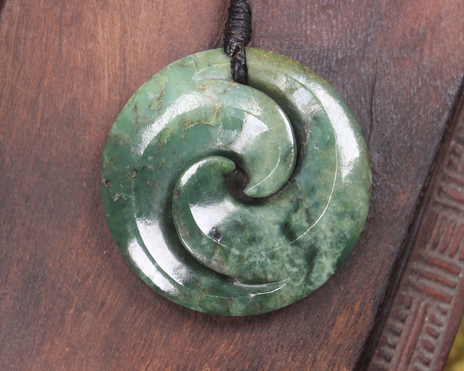 Koru pendant carved from Kawakawa Pounamu - NZ Greenstone