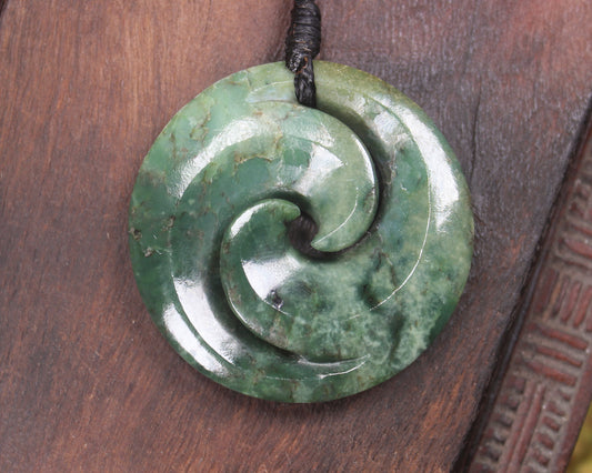 Koru pendant carved from Kawakawa Pounamu - NZ Greenstone