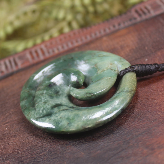 Koru pendant carved from Kawakawa Pounamu - NZ Greenstone