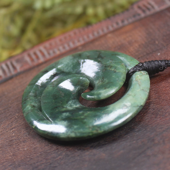 Koru pendant carved from Kawakawa Pounamu - NZ Greenstone