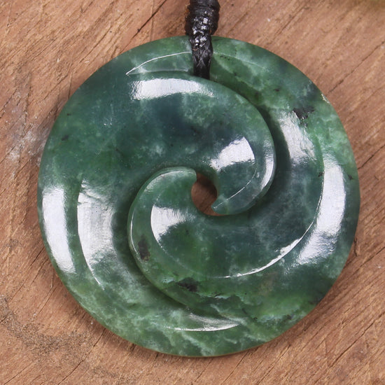 Koru pendant carved from Kawakawa Pounamu - NZ Greenstone