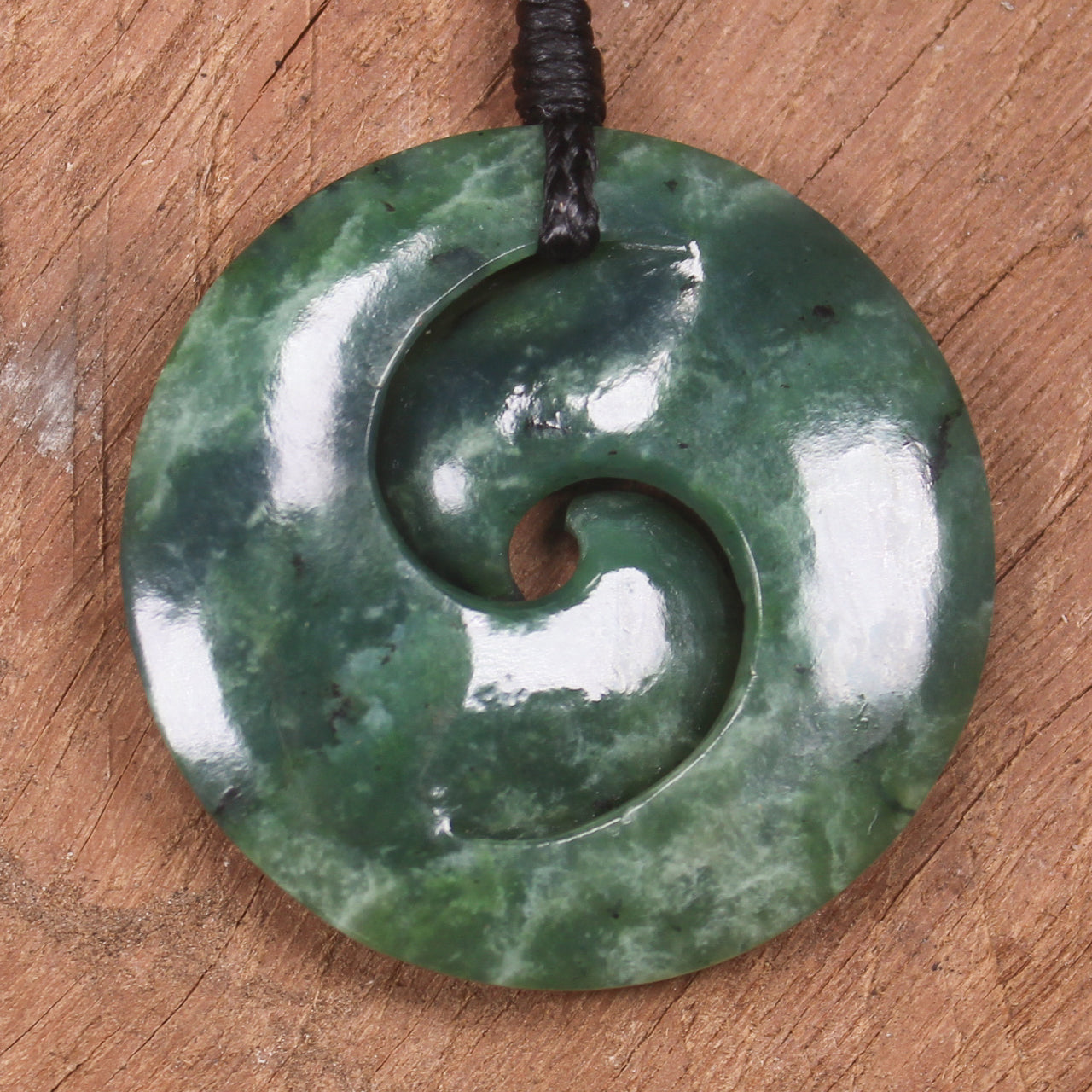 Koru pendant carved from Kawakawa Pounamu - NZ Greenstone