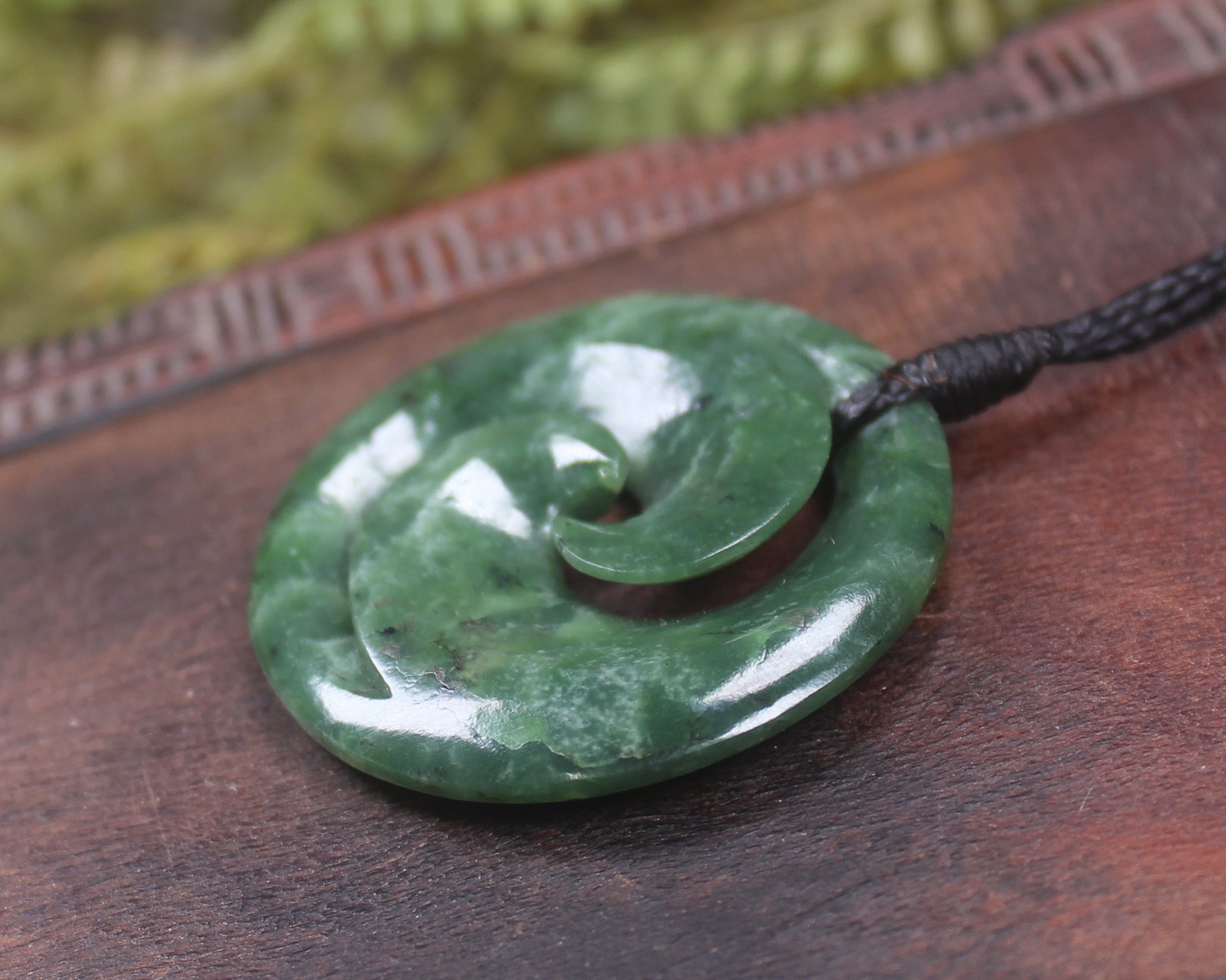 Koru pendant carved from Kawakawa Pounamu - NZ Greenstone