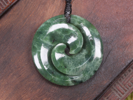 Koru pendant carved from Kawakawa Pounamu - NZ Greenstone