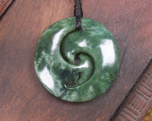 Koru pendant carved from Kawakawa Pounamu - NZ Greenstone