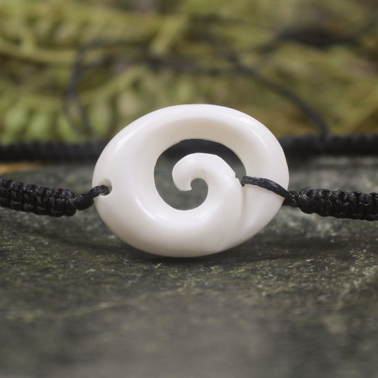 Adjustable cord bracelet with bone pendant