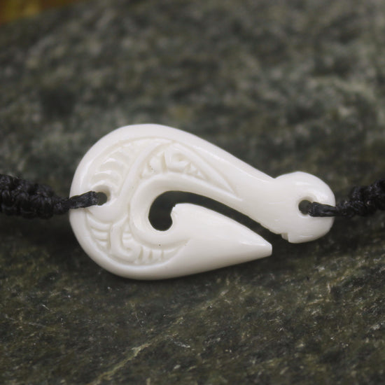 Adjustable cord bracelet with bone pendant