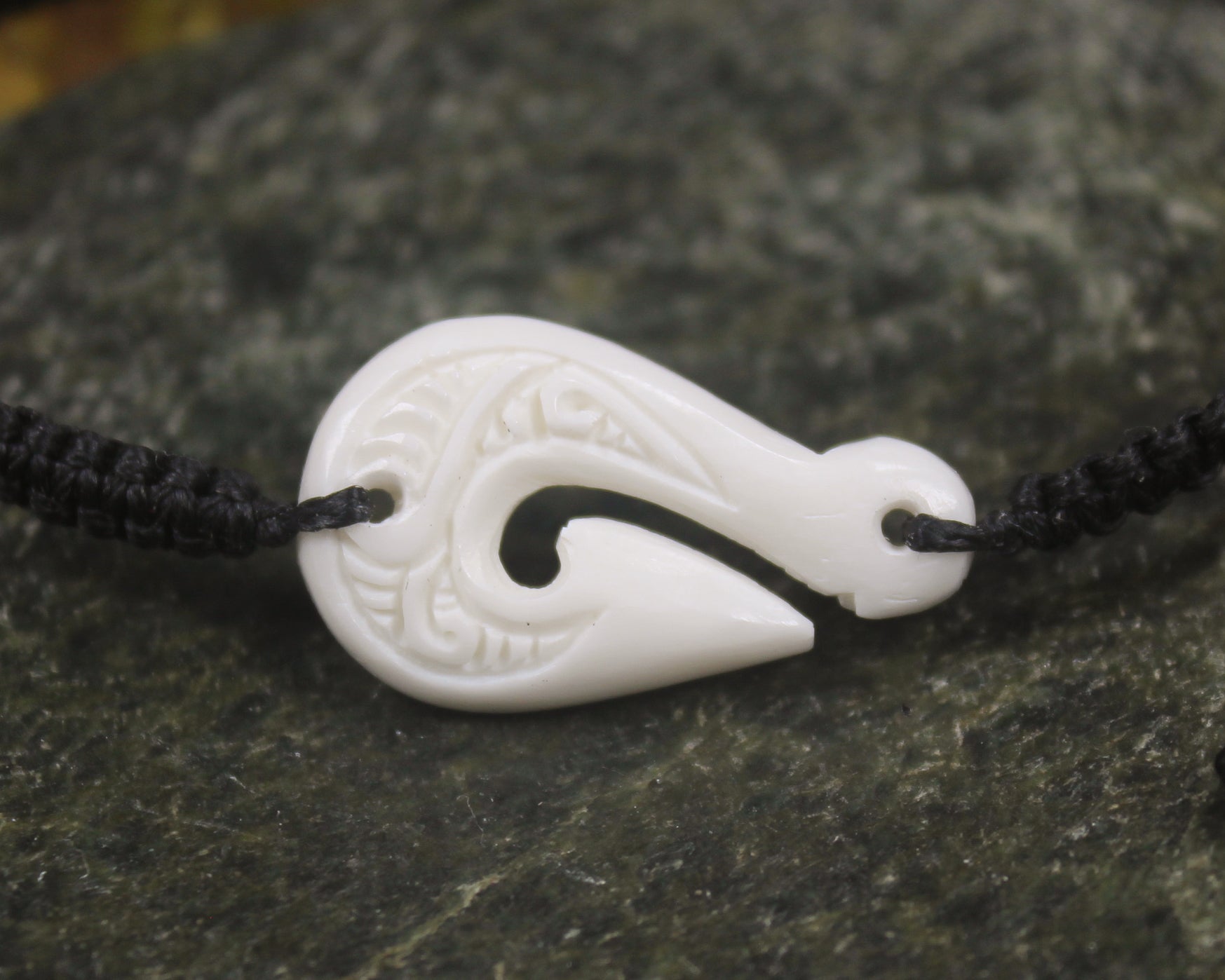 Adjustable cord bracelet with bone pendant