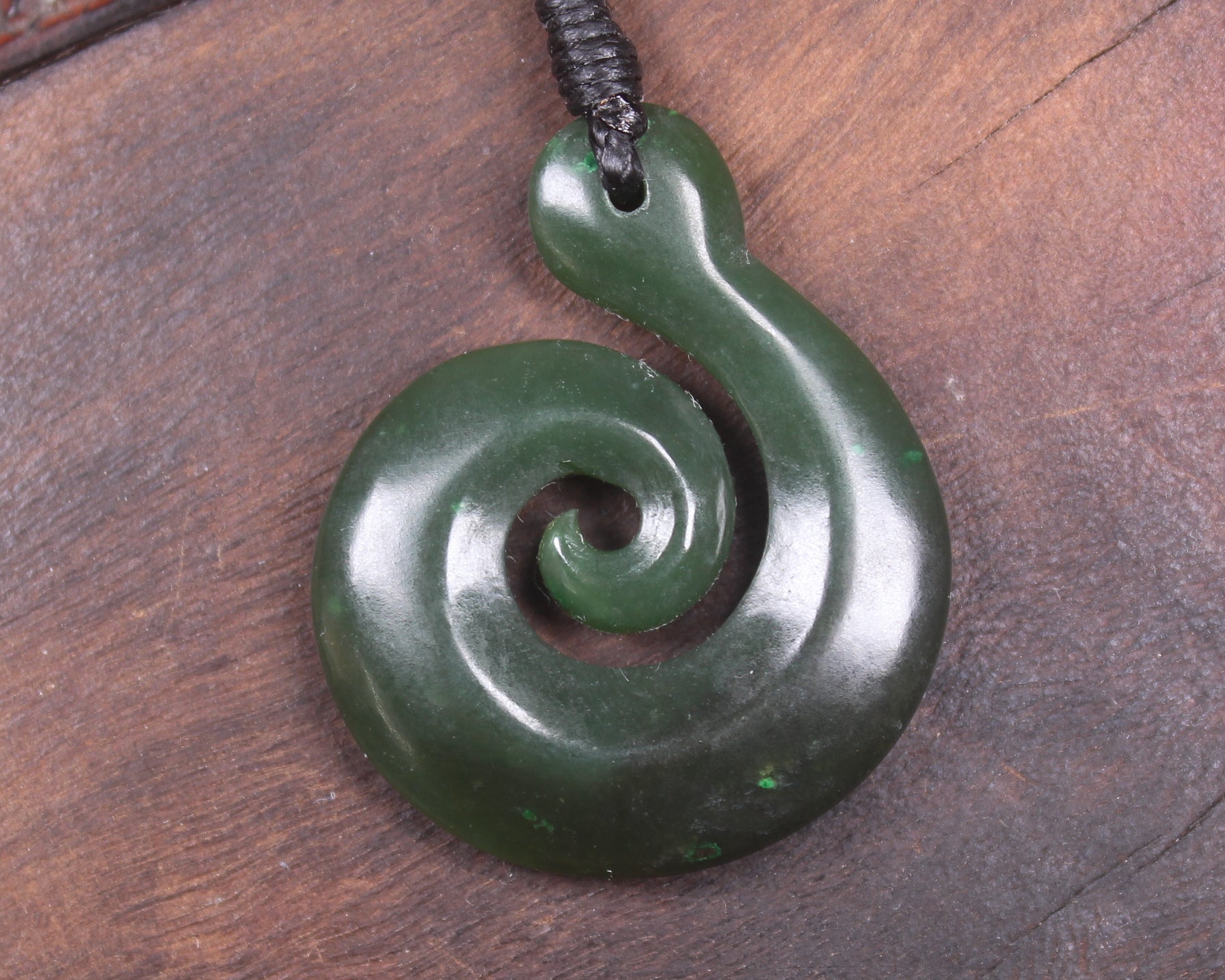 Koru pendant carved from Kawakawa Pounamu - NZ Greenstone