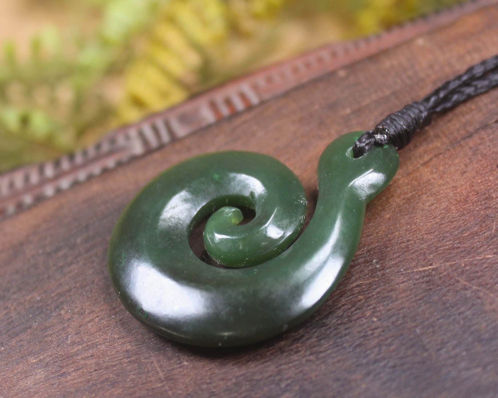 Koru pendant carved from Kawakawa Pounamu - NZ Greenstone