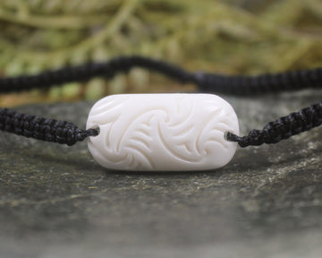 Adjustable cord bracelet with bone pendant