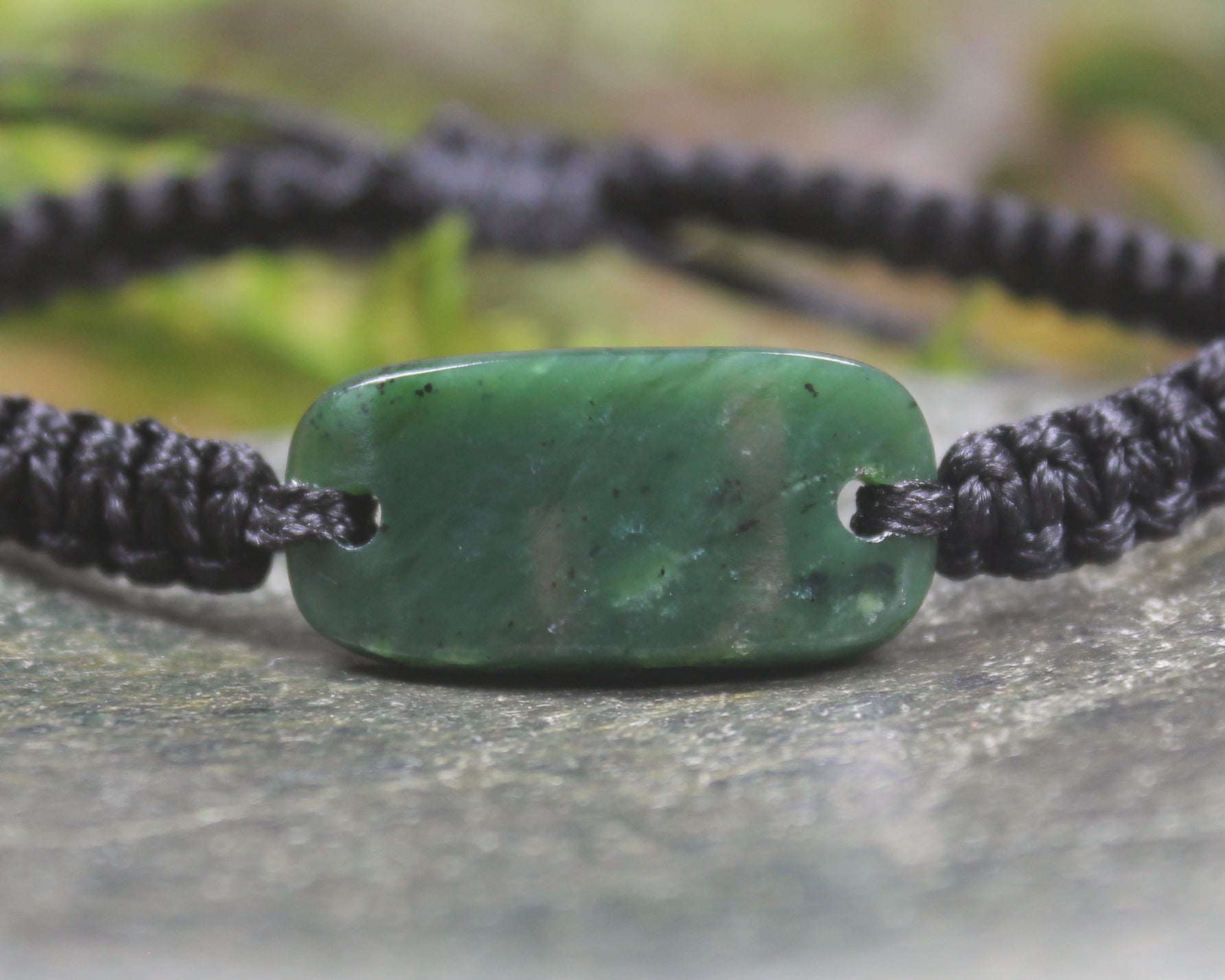 Adjustable cord bracelet with Kawakawa Pounamu