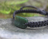 Adjustable cord bracelet with Kawakawa Pounamu