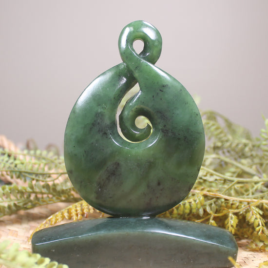 Hapopo Pounamu Koru Twist set on a Pounamu base - NZ Greenstone