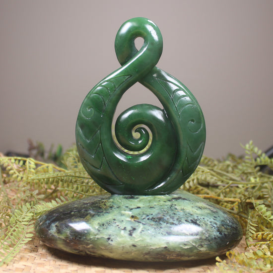 Kawakawa Pounamu Koru Twist set on a Pounamu base - NZ Greenstone